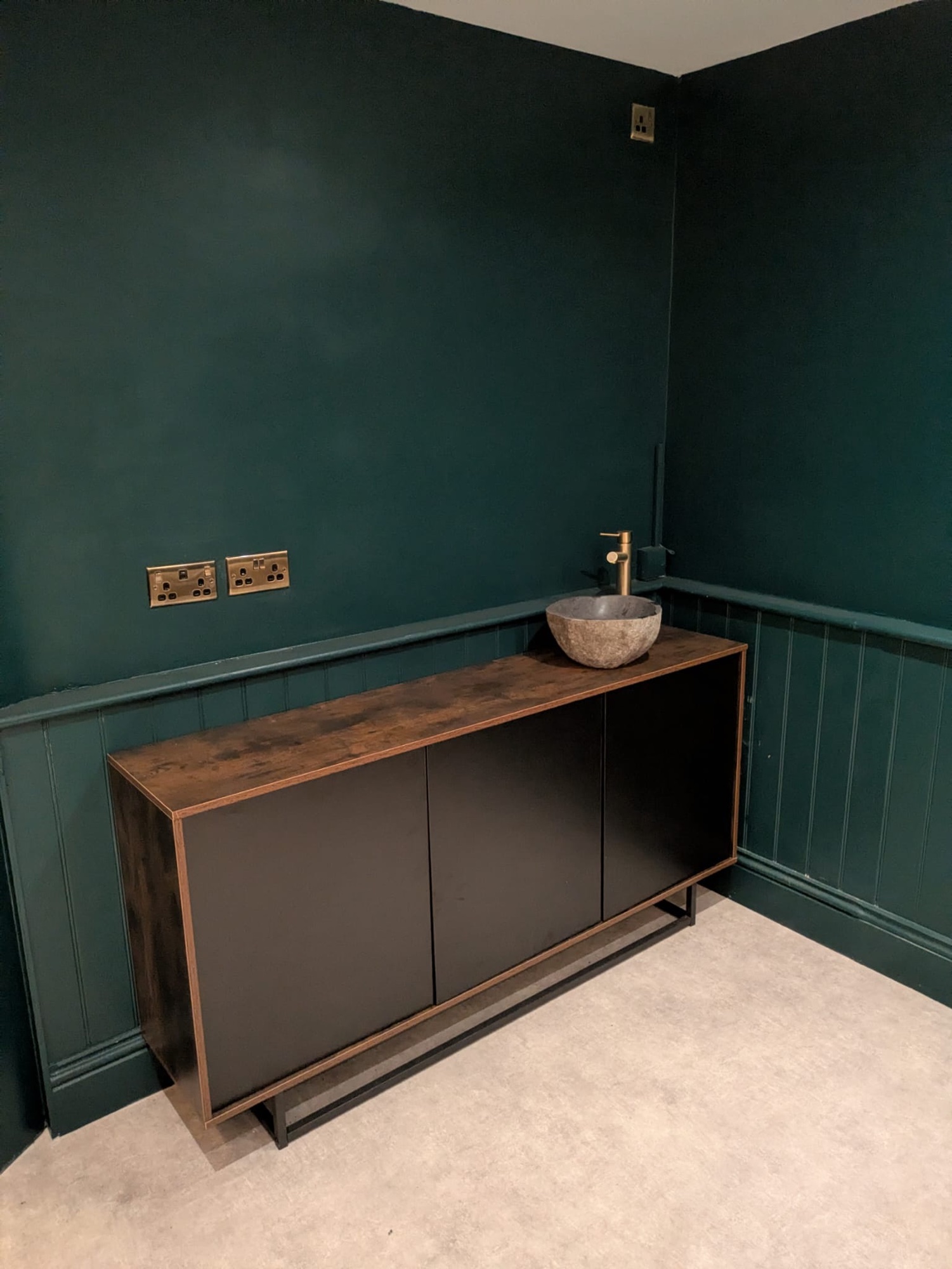 Bespoke cloakroom fit-out with panelling and vanity unit by Cover It Building